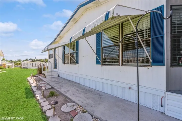 View of home's exterior featuring a lawn