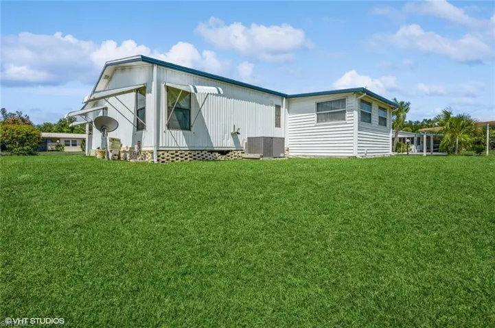 View of home's exterior with a lawn