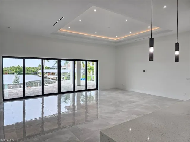 High tray ceiling with color changing LED rope lights in great room