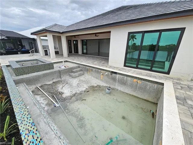 Pool deck is going to get a dark brown aluminium cage
