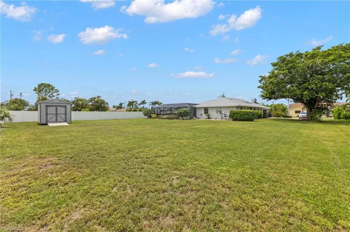 View of yard featuring a storage shed