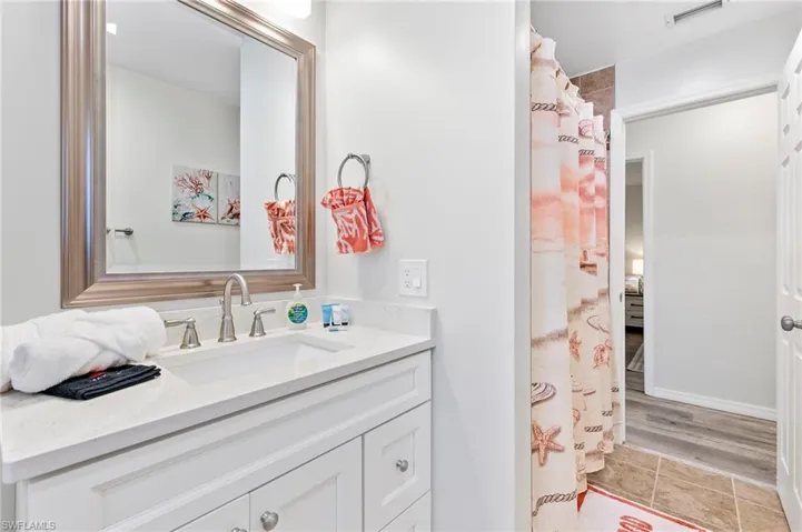 Bathroom with vanity and hardwood / wood-style flooring