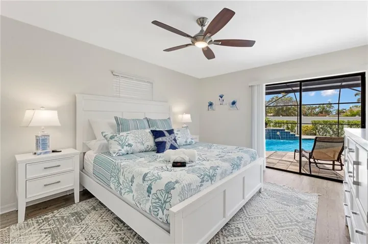 Bedroom featuring access to exterior, ceiling fan, and light wood-type flooring