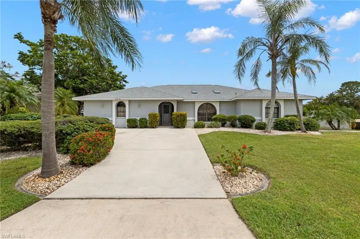 Single story home featuring a front yard