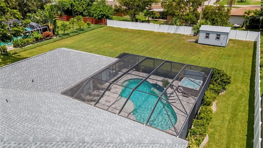 View of swimming pool featuring a lawn