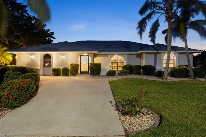 Ranch-style house featuring a lawn