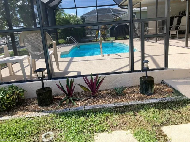 Swimming pool featuring a lanai, and a patio