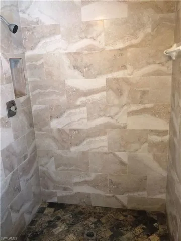 Bathroom featuring tiled shower
