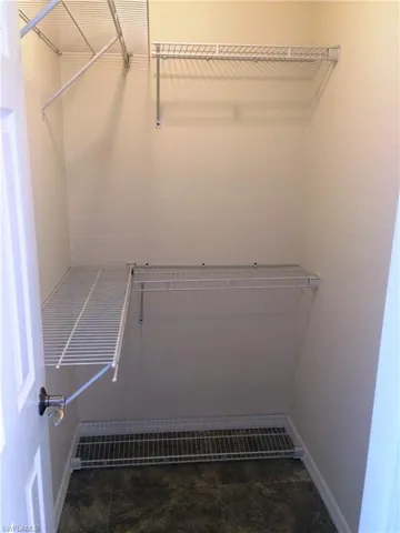 Walk in closet featuring tile patterned floors