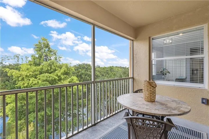 Screened in patio with a lovely lake view