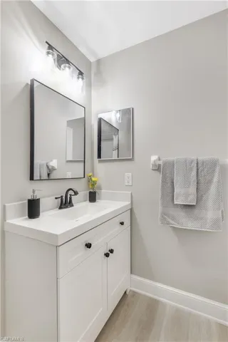 Guest Bathroom features new lighting and mirror