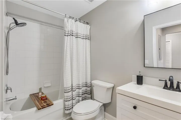 Guest bathroom features a tub/shower combo