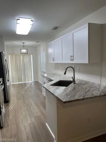 Kitchen featuring peninsula/bar