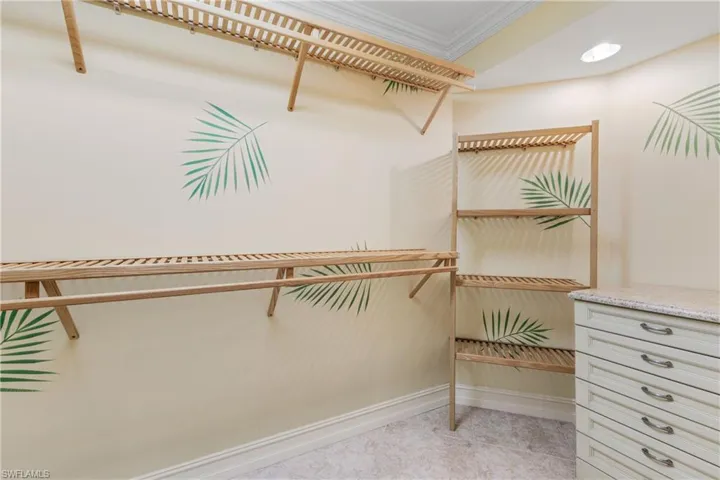 Spacious closet featuring light tile floors