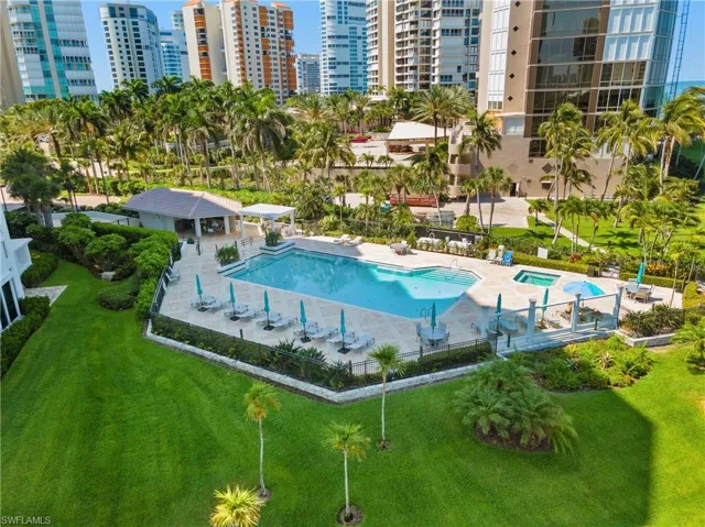 View of pool with a patio and a yard