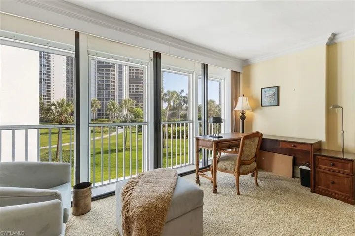 Carpeted home office featuring ornamental molding