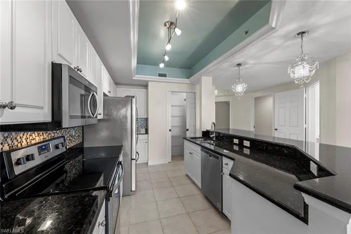 view of kitchen and pantry from the great room.