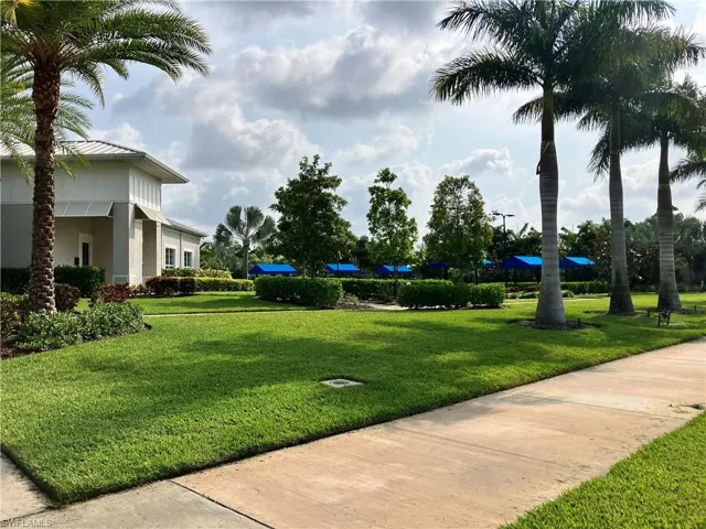 View of property's community with a yard