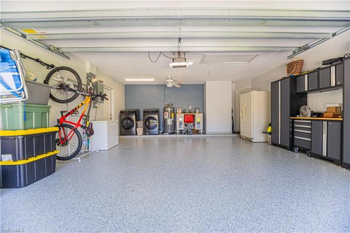 Epoxy Floor, metal cabinets, 4 bike rack, quiet smart LyftMaster Garage Door opener with MyQ controller for added security.