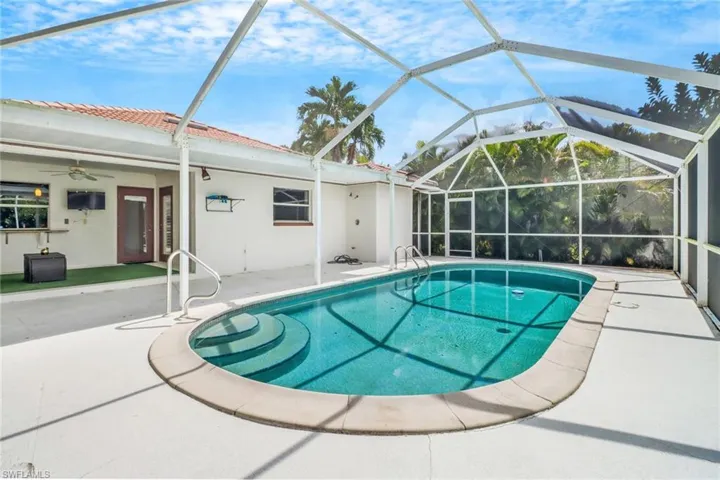View of pool with lanai enclosure