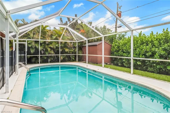View of pool featuring a lanai