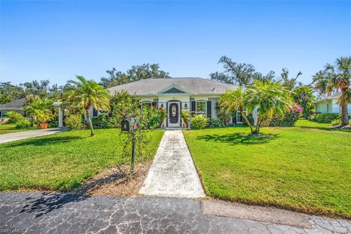 Single story home with a front lawn
