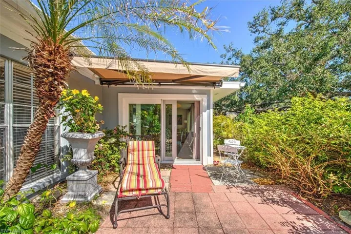 View of patio featuring a grill