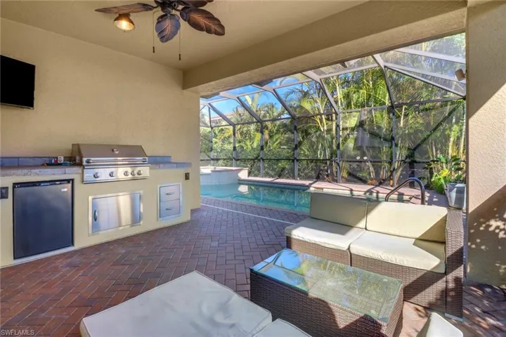 View of patio / terrace featuring a lanai, area for grilling, and outdoor lounge area
