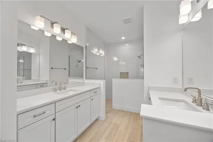 Full bath with two vanities and walk in shower
