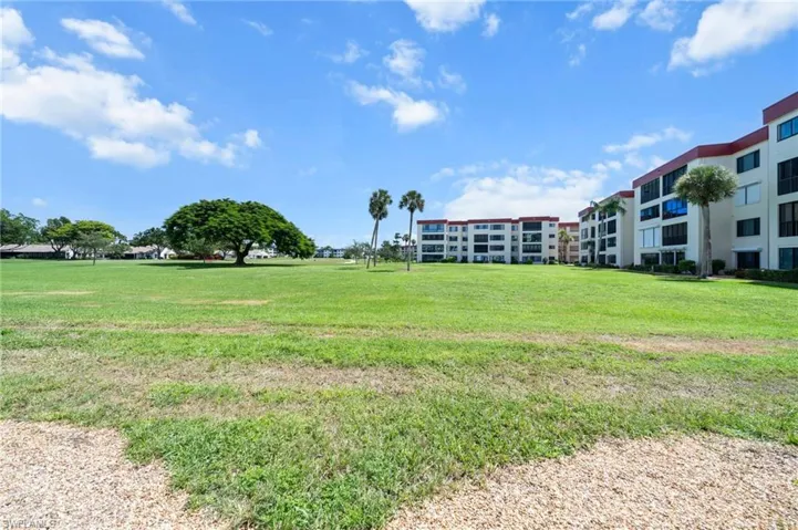 View of community featuring a yard