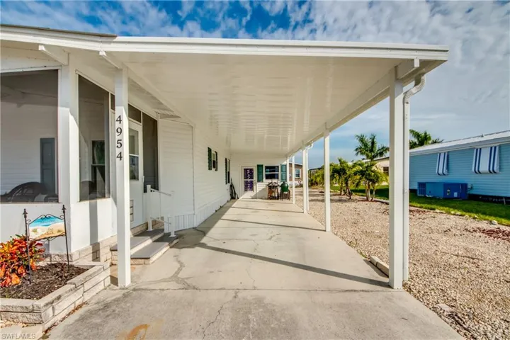 View of patio / terrace featuring an attached carport