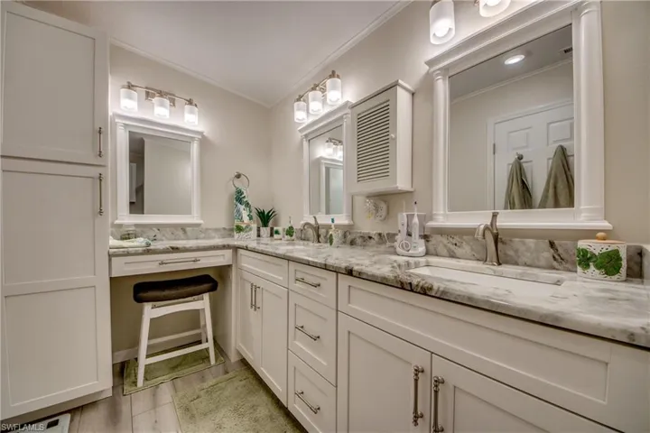 Full bathroom featuring vanity and a shower stall