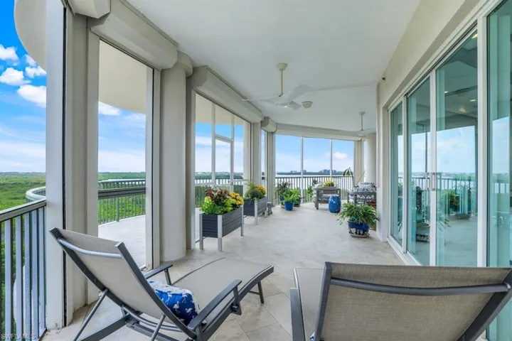 Sunroom featuring ceiling fan