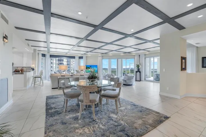 Dining area featuring beam ceiling and coffered ceiling