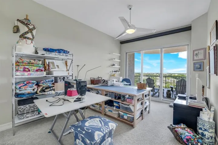 Carpeted office with ceiling fan