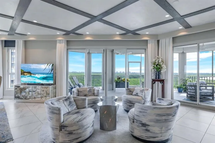 Living room with beam ceiling and coffered ceiling
