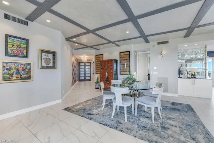 Dining area featuring beam ceiling and coffered ceiling