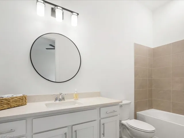 Full bath featuring toilet and vanity