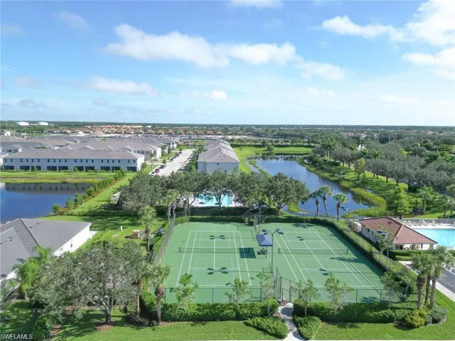 Aerial view of a nearby body of water and a pool area