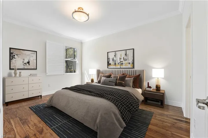 Virtual Staging - Master Bedroom featuring wood finished floors, ornamental molding, and baseboards.