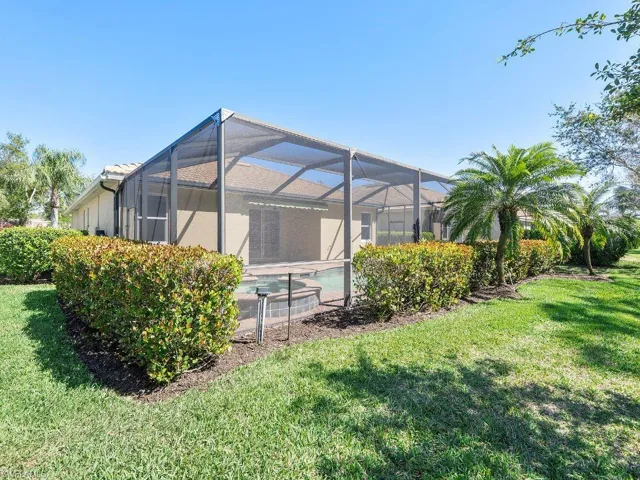 View of yard featuring an outdoor pool and a lanai