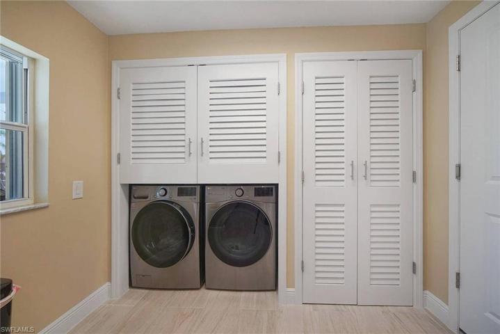 lots of storage for pantry and laundry behind the custom wood louvered doors.