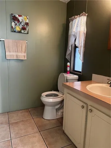Bathroom featuring vanity and light tile patterned floors