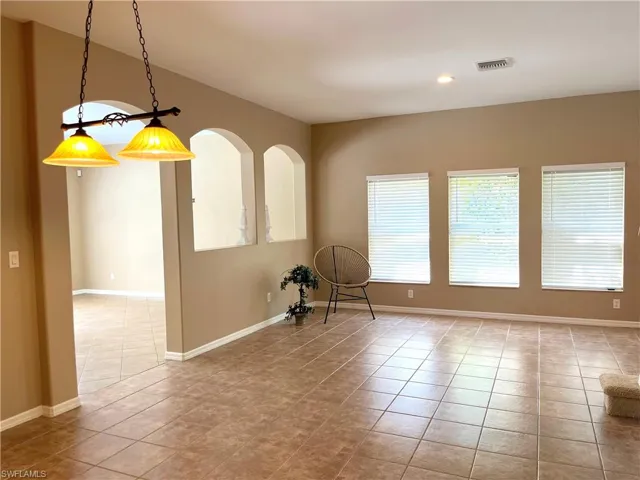 Spare room with light tile patterned floors