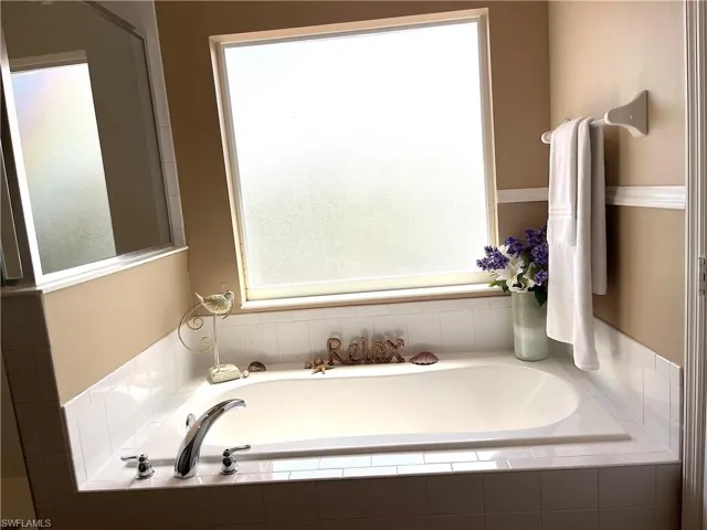 Full bathroom with a garden tub
