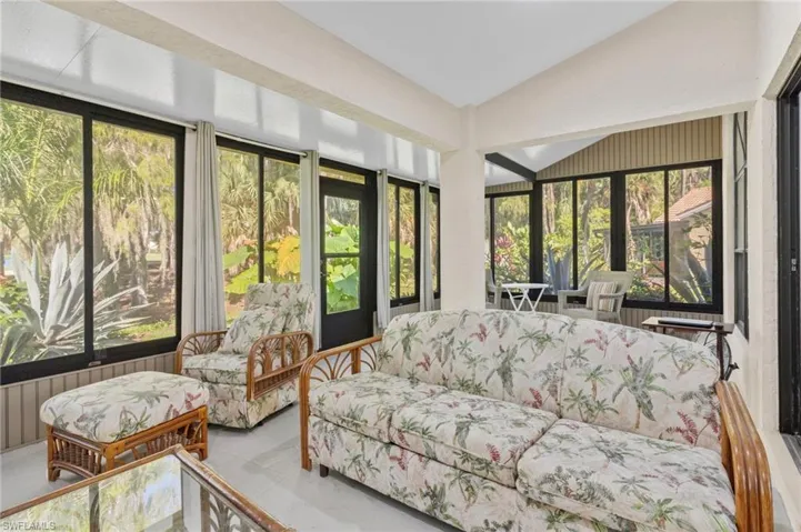 Sunroom with lofted ceiling