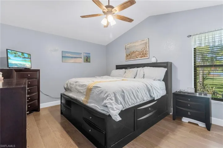 Master Bedroom featuring lofted ceiling, light hardwood / wood-style flooring, and ceiling fan