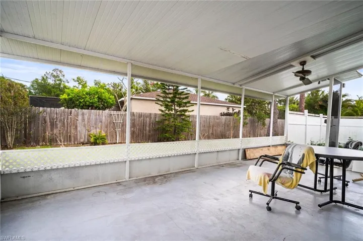 Sunroom featuring ceiling fan