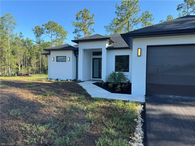 View of front of property with a garage