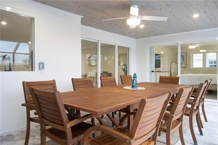 Dining area featuring wood ceiling and ceiling fan